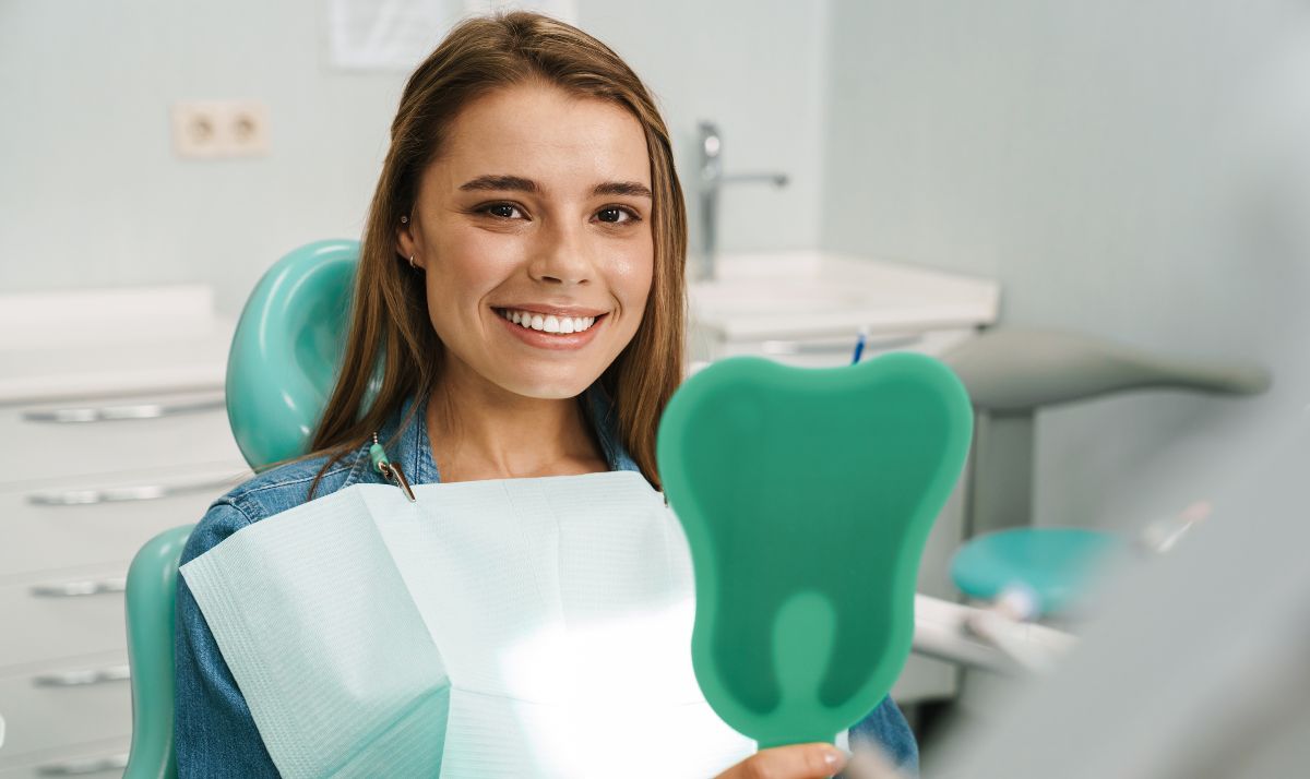 Woman patient smiling after KöR Whitening treatment