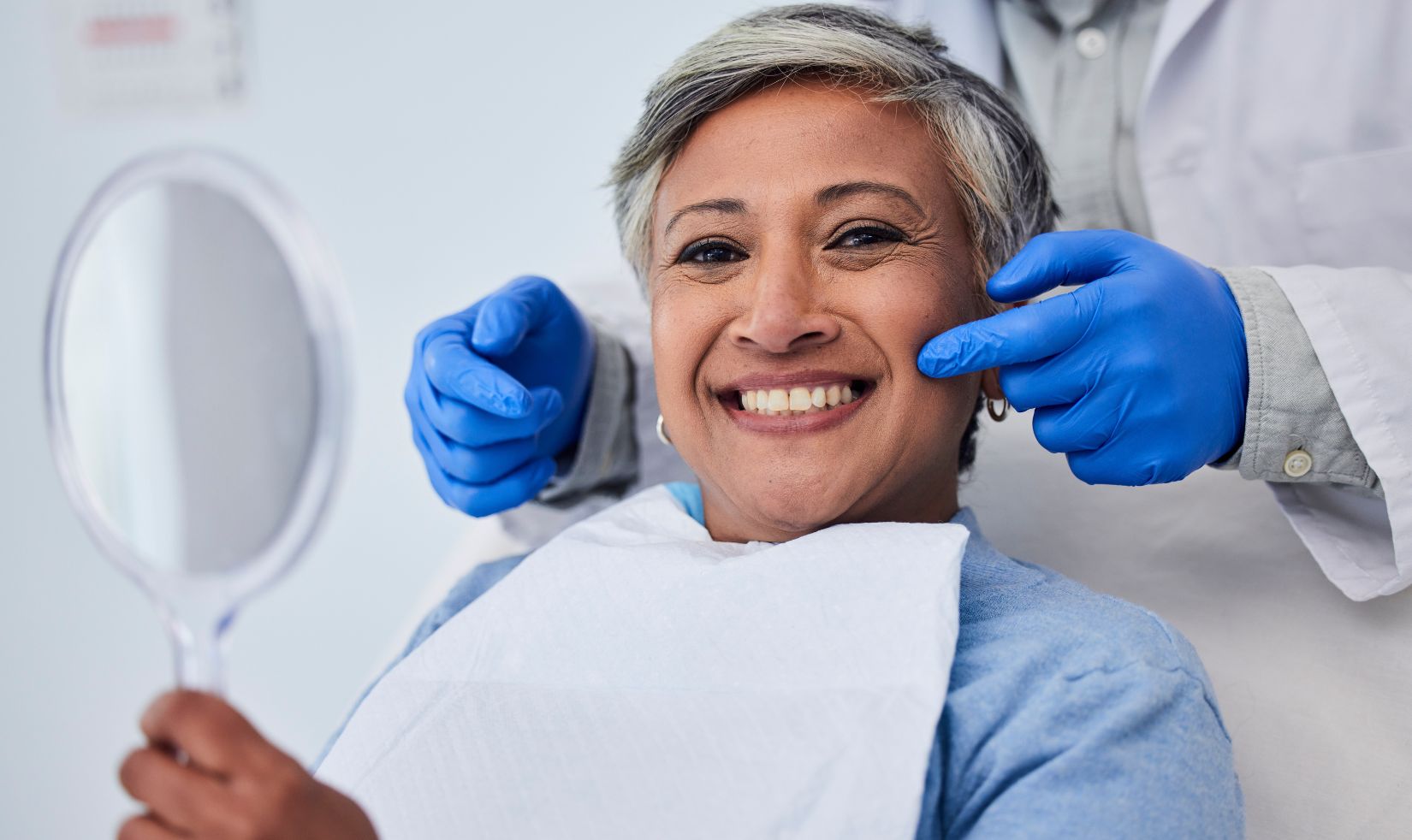 smiling woman after kör whitening treatment showcasing holistic dental benefits